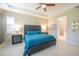 Comfortable main bedroom with ceiling fan, ensuite bathroom, and modern design at 179 Birchmont Dr, Deland, FL 32724