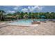 Community pool featuring a splash pad, tropical themed water features, and plenty of lounge seating at 179 Birchmont Dr, Deland, FL 32724
