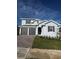 Charming two-story home with a brick driveway and well-maintained landscaping at 1881 Sunshine Peak Dr, Minneola, FL 34715