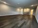 Open living area with hardwood floors and staircase at 1881 Sunshine Peak Dr, Minneola, FL 34715