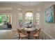 Charming breakfast nook with a round table, natural lighting, and comfortable seating at 2204 Baypoint Way, The Villages, FL 32162