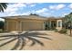 Lovely single story home featuring a three-car garage, desert landscaping, and a brick paved driveway at 2204 Baypoint Way, The Villages, FL 32162