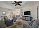 Spacious living room with tile floors, stylish furniture, and an open layout at 2204 Baypoint Way, The Villages, FL 32162