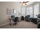 Home office features two workstations, natural light, and neutral paint at 2204 Baypoint Way, The Villages, FL 32162