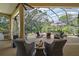 Screened patio featuring lounge chairs, outdoor seating, and a jacuzzi provides an inviting outdoor entertainment space at 2204 Baypoint Way, The Villages, FL 32162