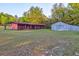 Outdoor barns and green pasture, perfect for livestock and rural living at 2227 S Spring Garden Ave, Deland, FL 32720
