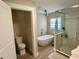Modern bathroom featuring a standalone tub, glass-enclosed shower, and stylish fixtures at 2227 S Spring Garden Ave, Deland, FL 32720
