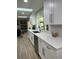 Well-lit kitchen featuring white cabinets, quartz countertops and stainless steel appliances at 2227 S Spring Garden Ave, Deland, FL 32720