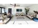 Bright living area with comfortable seating, ceiling fan, and neutral color scheme at 2227 S Spring Garden Ave, Deland, FL 32720