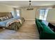Spacious main bedroom with comfortable furnishings and access to a screened lanai at 2227 S Spring Garden Ave, Deland, FL 32720
