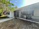 Charming screened-in porch with rocking chairs, offering a peaceful outdoor space at 2227 S Spring Garden Ave, Deland, FL 32720