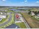 Desirable townhome community boasts a serene setting near a lake and offers modern living at 2552 Chickasaw Plum Loop, Clermont, FL 34711