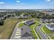 Beautiful townhome community boasts a serene setting, well-maintained lawns, and convenient parking at 2552 Chickasaw Plum Loop, Clermont, FL 34711