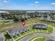 An aerial view of townhomes surrounded by green spaces, highlighting the community's desirable location at 2552 Chickasaw Plum Loop, Clermont, FL 34711