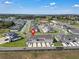 Desirable townhome community boasts a serene setting, well-maintained lawns, and convenient parking at 2552 Chickasaw Plum Loop, Clermont, FL 34711