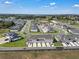 New construction homes showing modern home design, green lawns, and convenient parking at 2552 Chickasaw Plum Loop, Clermont, FL 34711