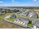 New townhome community offers modern living with manicured green spaces and convenient parking at 2552 Chickasaw Plum Loop, Clermont, FL 34711