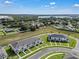 Aerial view of the neighborhood, showcasing manicured lawns at 2552 Chickasaw Plum Loop, Clermont, FL 34711