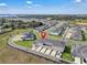 Aerial view of townhomes, with convenient parking, and beautiful surroundings at 2552 Chickasaw Plum Loop, Clermont, FL 34711