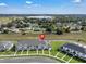 Aerial view of townhomes showcasing the neighborhood layout at 2552 Chickasaw Plum Loop, Clermont, FL 34711