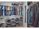 Walk-in closet with ample storage, multiple shelves, and hanging racks at 2552 Chickasaw Plum Loop, Clermont, FL 34711