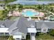 Aerial view of a community pool area, including lounge chairs and recreational features at 2552 Chickasaw Plum Loop, Clermont, FL 34711