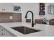 Kitchen with black modern faucet over white countertop at 2552 Chickasaw Plum Loop, Clermont, FL 34711