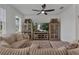 Open living room featuring comfortable seating and a modern entertainment center at 2552 Chickasaw Plum Loop, Clermont, FL 34711