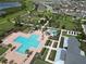 Aerial view of a sparkling community pool with lounge chairs and lush landscaping for relaxing at 2552 Chickasaw Plum Loop, Clermont, FL 34711