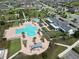 Community pool and amenity center with a playground and bocce ball court at 2552 Chickasaw Plum Loop, Clermont, FL 34711