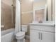 Bathroom features a shower/tub combo, white vanity, and neutral wall colors at 2602 Stargrass Cir, Clermont, FL 34715