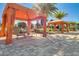 Charming pool cabanas featuring comfortable seating and landscaping at 2602 Stargrass Cir, Clermont, FL 34715