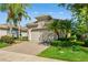 Charming single-Gathering home with a brick paver driveway and well-manicured landscaping at 2602 Stargrass Cir, Clermont, FL 34715