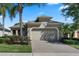 Charming single-Gathering home with a brick paver driveway and well-manicured landscaping at 2602 Stargrass Cir, Clermont, FL 34715