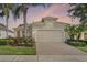 Charming single-Gathering home with a brick paver driveway and well-manicured landscaping at 2602 Stargrass Cir, Clermont, FL 34715