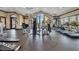 Well-equipped gym featuring modern machines, ceiling fans, and large windows for natural light at 2602 Stargrass Cir, Clermont, FL 34715