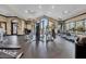 Well-equipped gym featuring modern machines, ceiling fans, and large windows for natural light at 2602 Stargrass Cir, Clermont, FL 34715