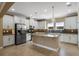 Spacious kitchen featuring granite countertops, stainless steel appliances and recessed lighting at 2602 Stargrass Cir, Clermont, FL 34715