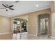 Spacious living room showcases sliding glass doors to lanai and neutral color palette at 2602 Stargrass Cir, Clermont, FL 34715