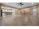 Open-concept layout with tile floors, neutral paint, and seamless flow between rooms at 2602 Stargrass Cir, Clermont, FL 34715