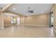 Open floor plan with tile flooring, neutral colors, and lots of natural light at 2602 Stargrass Cir, Clermont, FL 34715