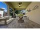 Comfortable patio area featuring a fire pit and outdoor seating, perfect for entertaining at 2602 Stargrass Cir, Clermont, FL 34715