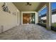 View of a screened patio area with a sliding glass door that leads into a spacious interior at 2602 Stargrass Cir, Clermont, FL 34715