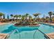 Beautiful pool with center island and tropical landscaping, perfect for enjoying the Florida sunshine at 2602 Stargrass Cir, Clermont, FL 34715