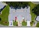 Inviting exterior view shows well-manicured lawns and paved driveways at 26030 Newcombe Cir, Leesburg, FL 34748