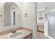 Bathroom featuring a vanity and walk-in shower at 26030 Newcombe Cir, Leesburg, FL 34748