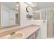 Bathroom featuring a vanity and walk-in shower at 26030 Newcombe Cir, Leesburg, FL 34748