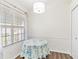 Breakfast nook with a table covered in a blue floral tablecloth at 26030 Newcombe Cir, Leesburg, FL 34748