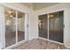 Enclosed lanai with ceiling fans and tiled floors at 26030 Newcombe Cir, Leesburg, FL 34748