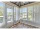 Enclosed lanai with views of the community's green spaces at 26030 Newcombe Cir, Leesburg, FL 34748